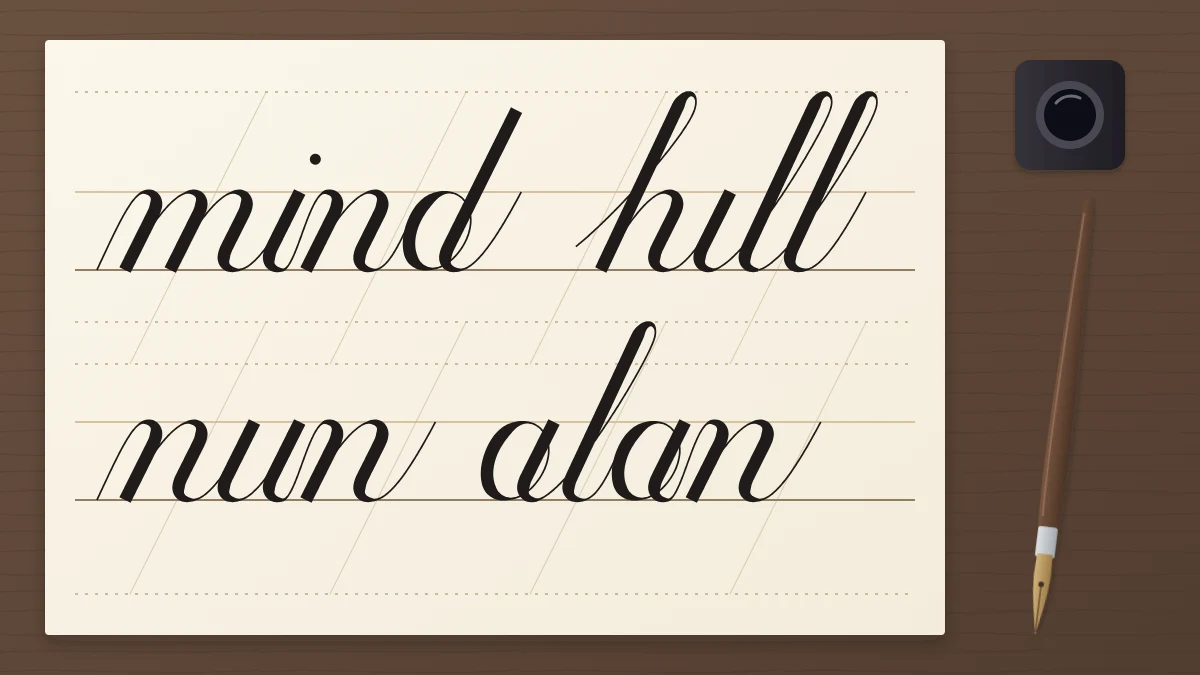 A ruled ivory sheet with a script phrase beginning with the word mind across two guideline rows, a pointed pen and ink bottle at the side